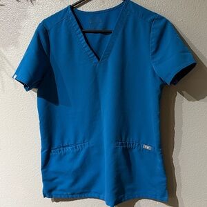 FIGS Women’s scrub top. PO# 1652 Alps blue. Size Small. Excellent condition